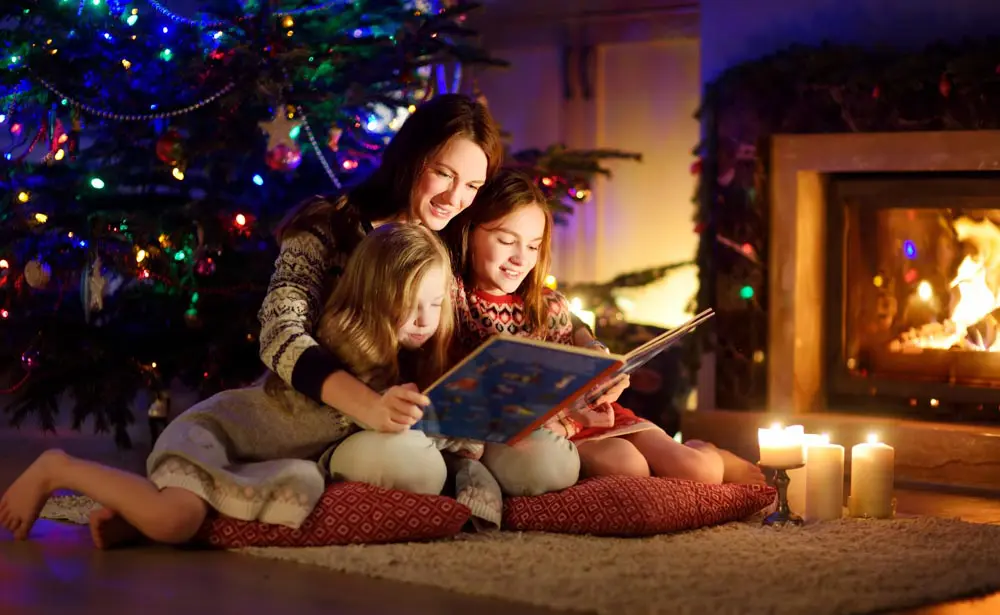 Family Reading In front of Fireplace